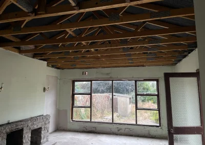 Exposed ceiling timbers during a house rewiring project.