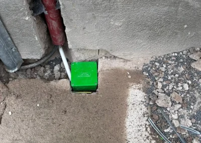 An exterior earthing point beside the building.