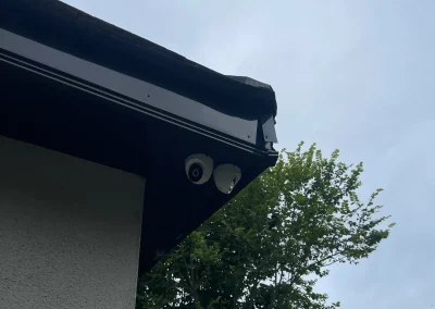 A security camera positioned beneath the roofline.