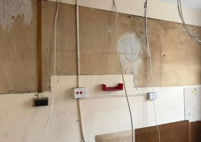 Kitchen wiring work during a renovation.