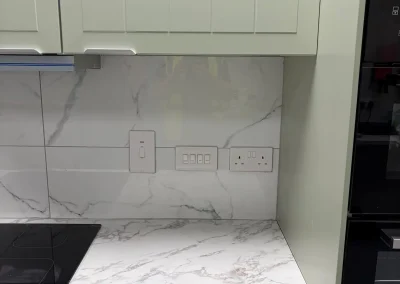 Kitchen sockets and switches above the worktop.