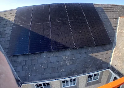 Solar panels installed on a slate roof.