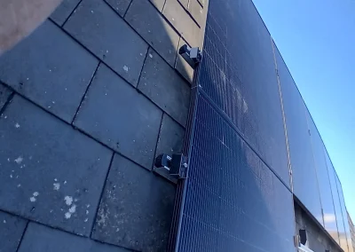 A closer look at solar-panel mounting on a slate roof.