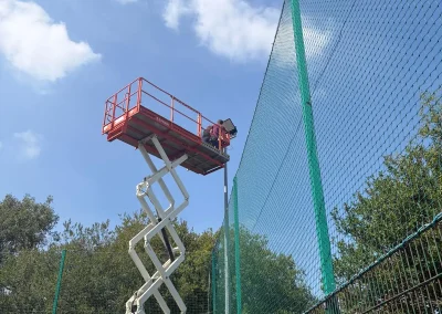 Floodlight installation at a sports ground.