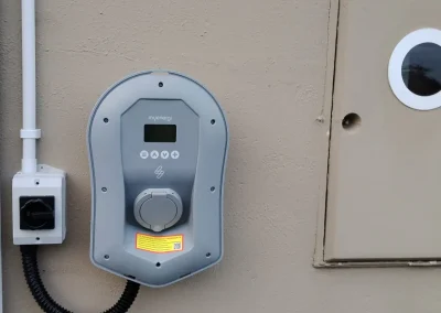 Wall-mounted electric vehicle charging point.