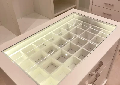 Integrated lighting inside a dressing-room drawer.